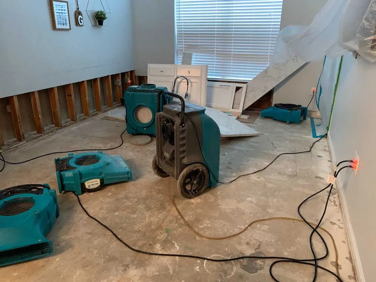 Dehumidifier in flood-cut room for Water Damage Restoration in Tarrant